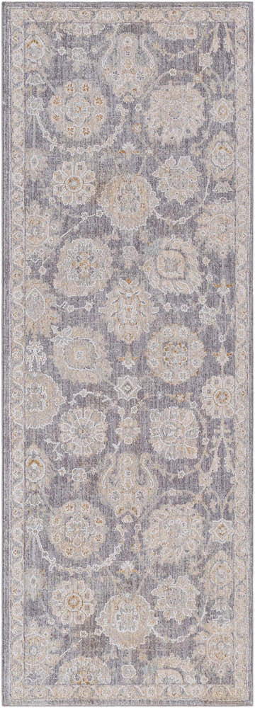 Close-up of the Mimarsinan Thick Luxe Statement Rug. Features a traditional floral pattern in gray, beige, and brown tones. Design-Runner-2773