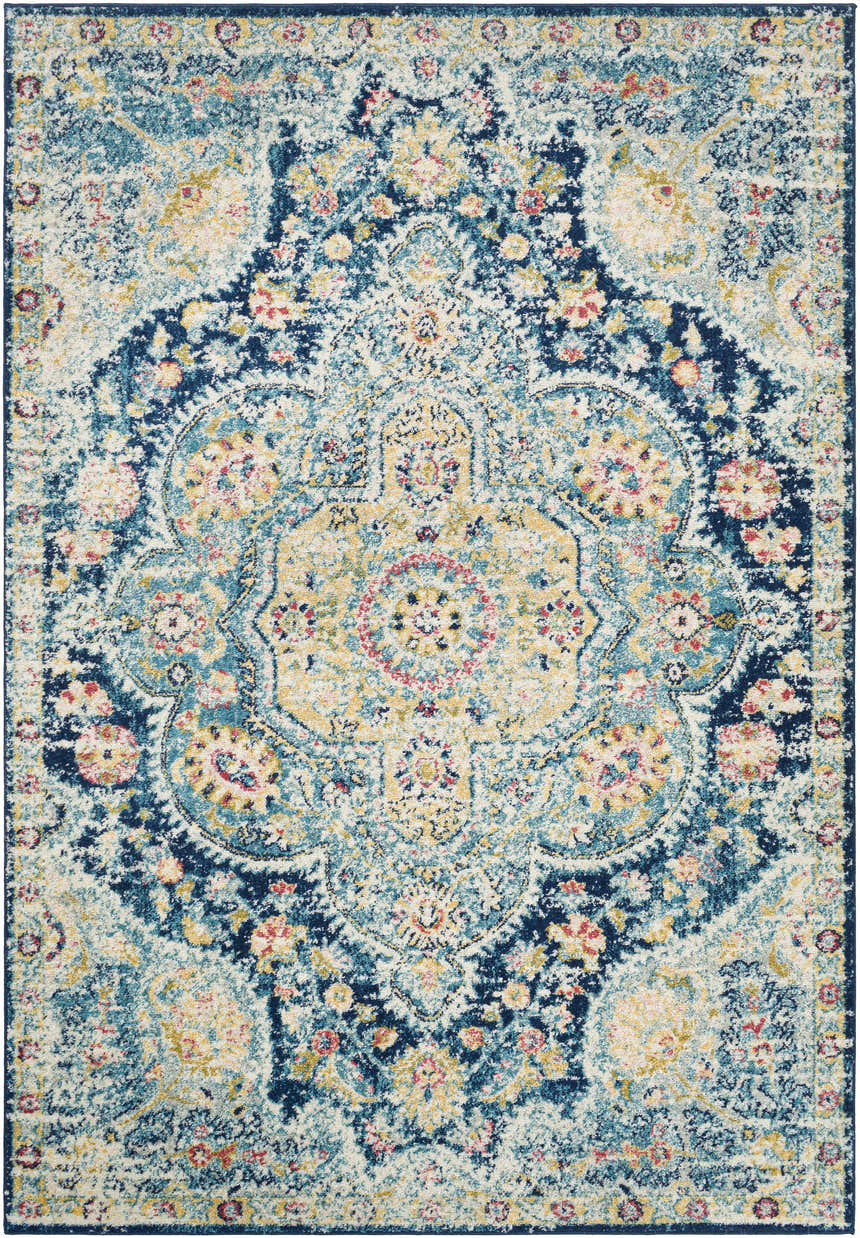 Close-up of the Mallacoota Area Rug. Features cream, dark pink, light slate, navy, rose, sky blue, and yellow colors. Design-Rectangle-5376