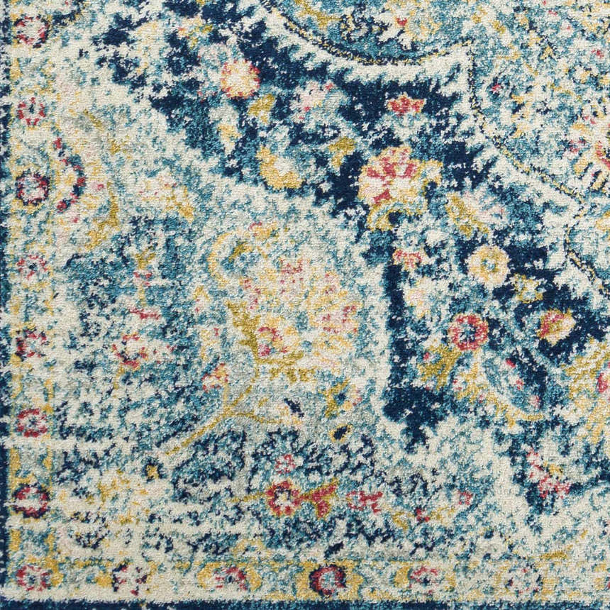Detailed close up of the Mallacoota Area Rug's cream, navy, pink, and yellow traditional design. Swatch