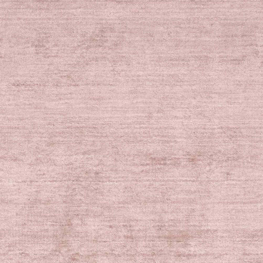 Close-up of the Millinocket Area Rug. Dusty pink, hand-loomed, contemporary style, and soft viscose texture. Swatch