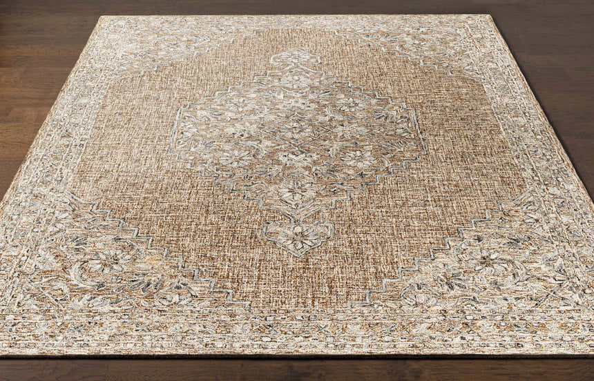 Close-up of the Modimolle Area Carpet, a hand-tufted rug with a traditional Persian-style design in brown, camel, and cream tones. Front