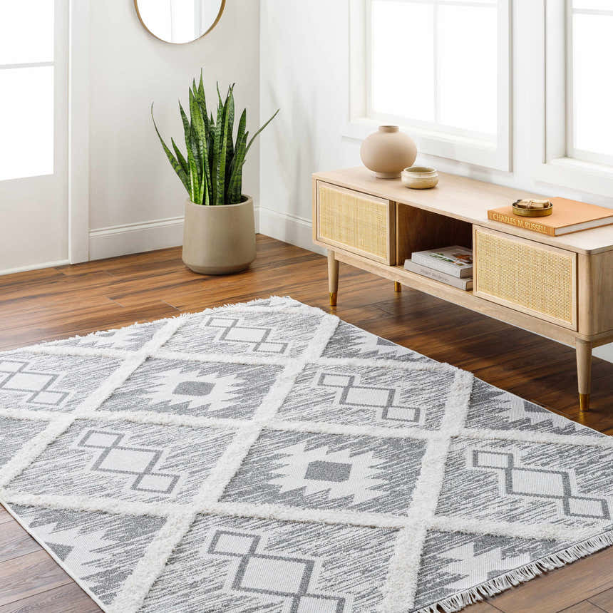 Entryway with Moto Area Rug in arctic stone and gray, styled with a console table, plant, and wood floors. Roomscene-Rectangle