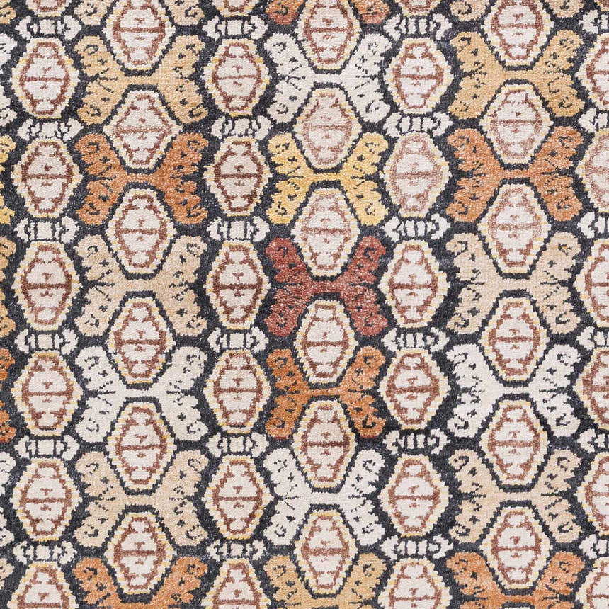 Close-up of the Mercersburg Carpet. Hand-knotted rug in black, brick red, beige, burnt orange, and mustard colors. Contemporary style. Swatch