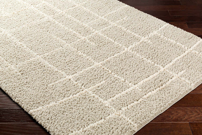 Close up of a lambswool Maro Area Rug with a subtle geometric shag design. Corner
