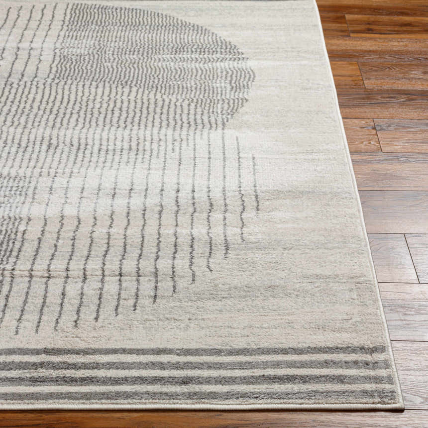 Close-up of the Amar Area Rug showing its geometric gray and natural pattern and soft texture. Front