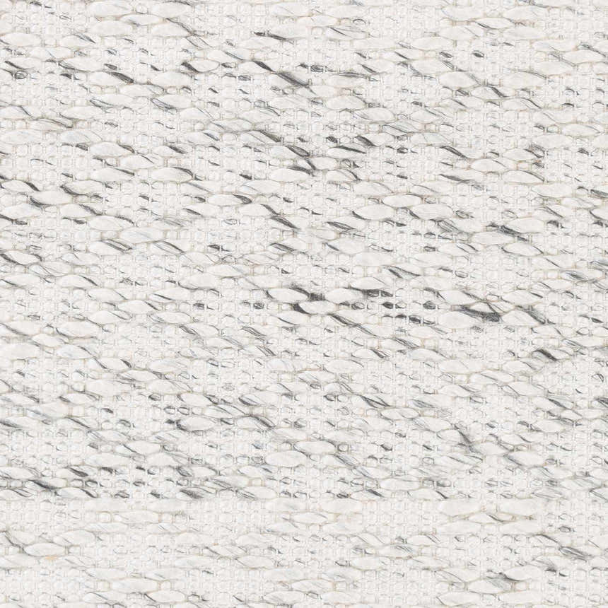 Close-up of the hand woven Martin Area Rug. Black and ivory polyester rug with a contemporary, natural fiber design. Swatch