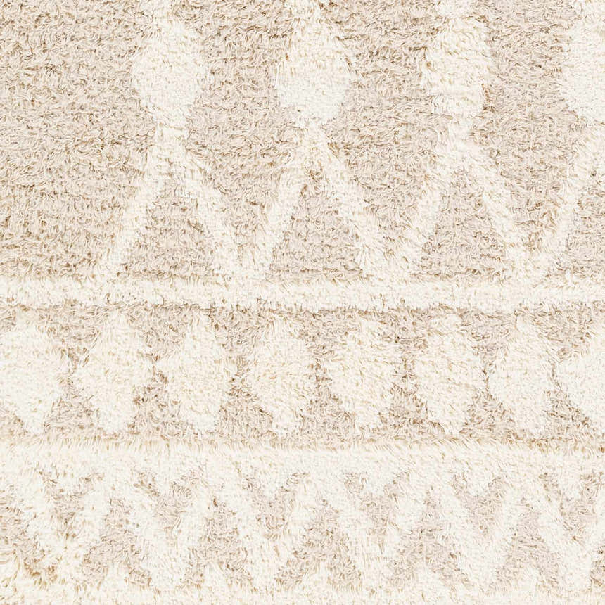 Close-up of the Maso Shag Area Rug showing its geometric pattern and soft, textured shag in gray, light peach, and nutmeg tones. Swatch