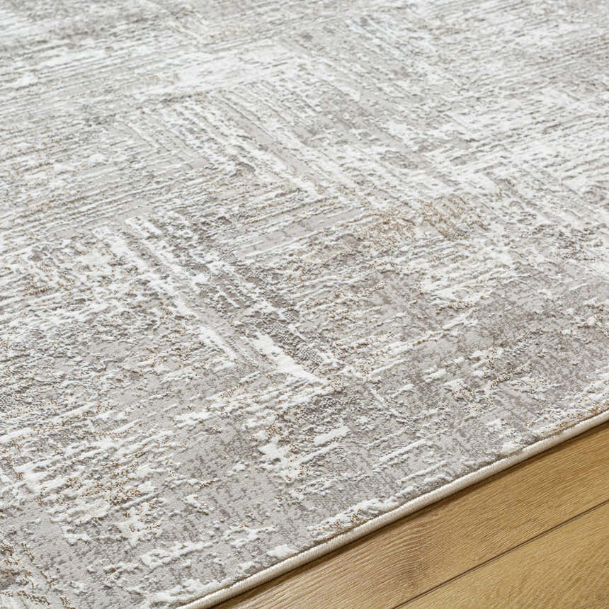 Close up of the Nannyville area rug showing bone, ivory, and gray contemporary design. Texture