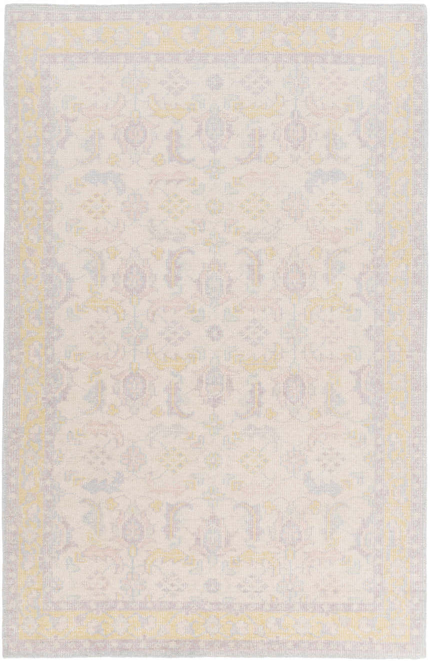 Close-up of the hand-knotted Navarino Area Rug. Traditional design in light beige, dusty pink, and mustard tones. Design-Rectangle-5686