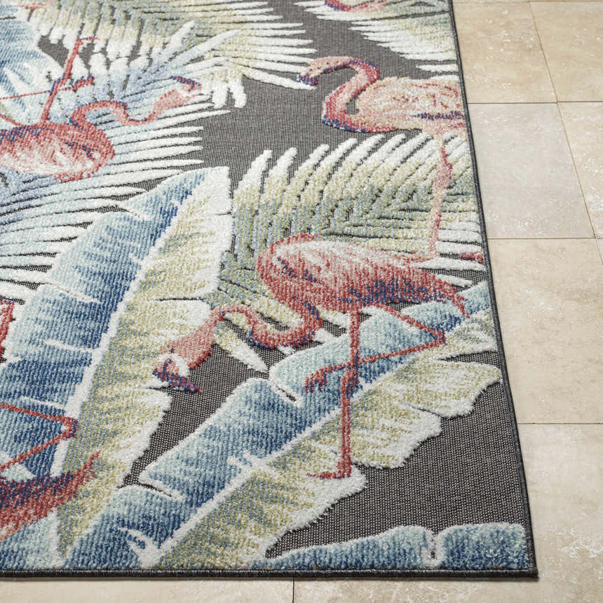 Close-up of Nayan Charcoal Area Rug featuring a coastal design with flamingos and tropical leaves in blue, cream, olive, and rust. Front