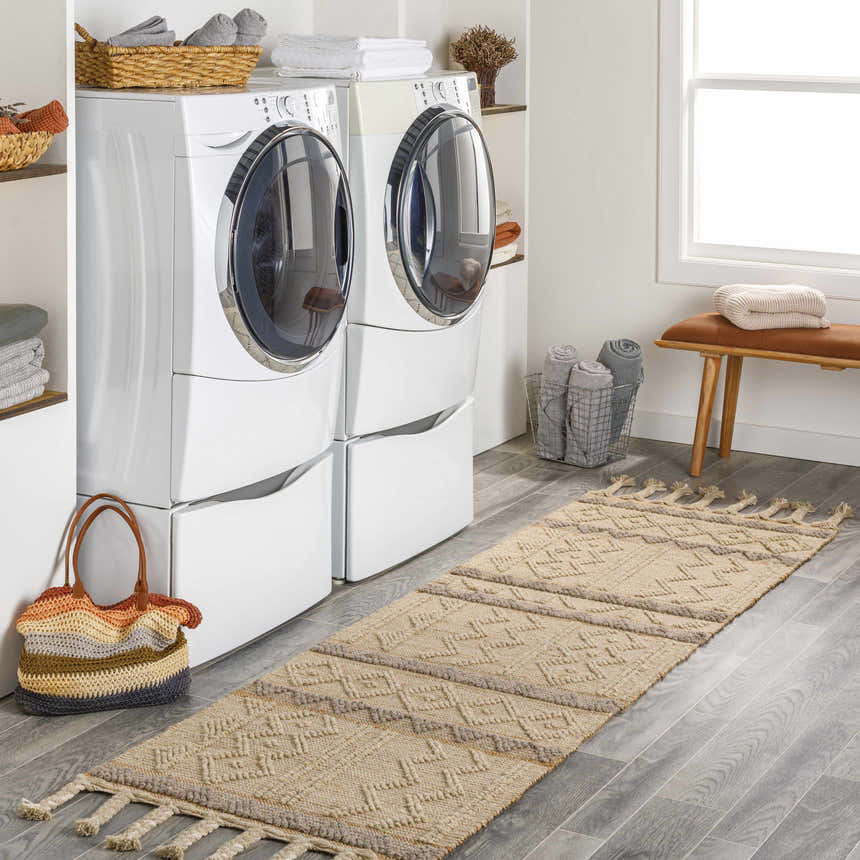 Bright laundry room with white washer and dryer, and tan Okurcalar Area Carpet runner with tassels. Roomscene-Runner