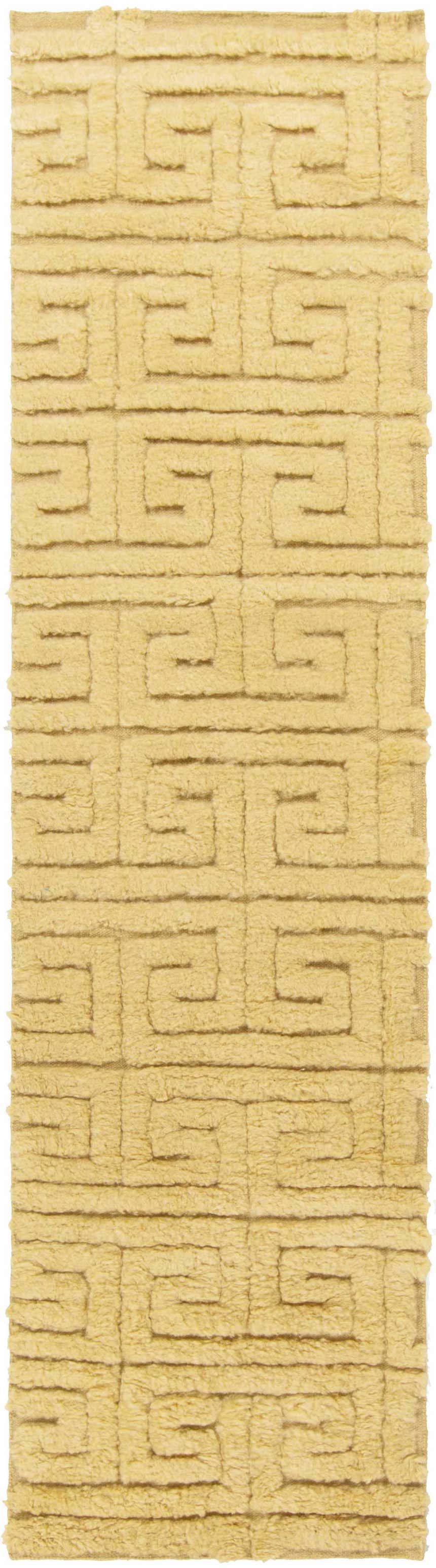 Close-up of the Omagh Area Rug. Mustard color, hand woven wool with a geometric Greek key design. Shag texture. Design-Runner-268
