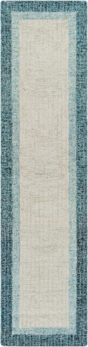 Close-up of the hand-tufted Padada Green Bordered Cream Wool Rug with teal, light blue, and cream colors. Design-Runner-2610