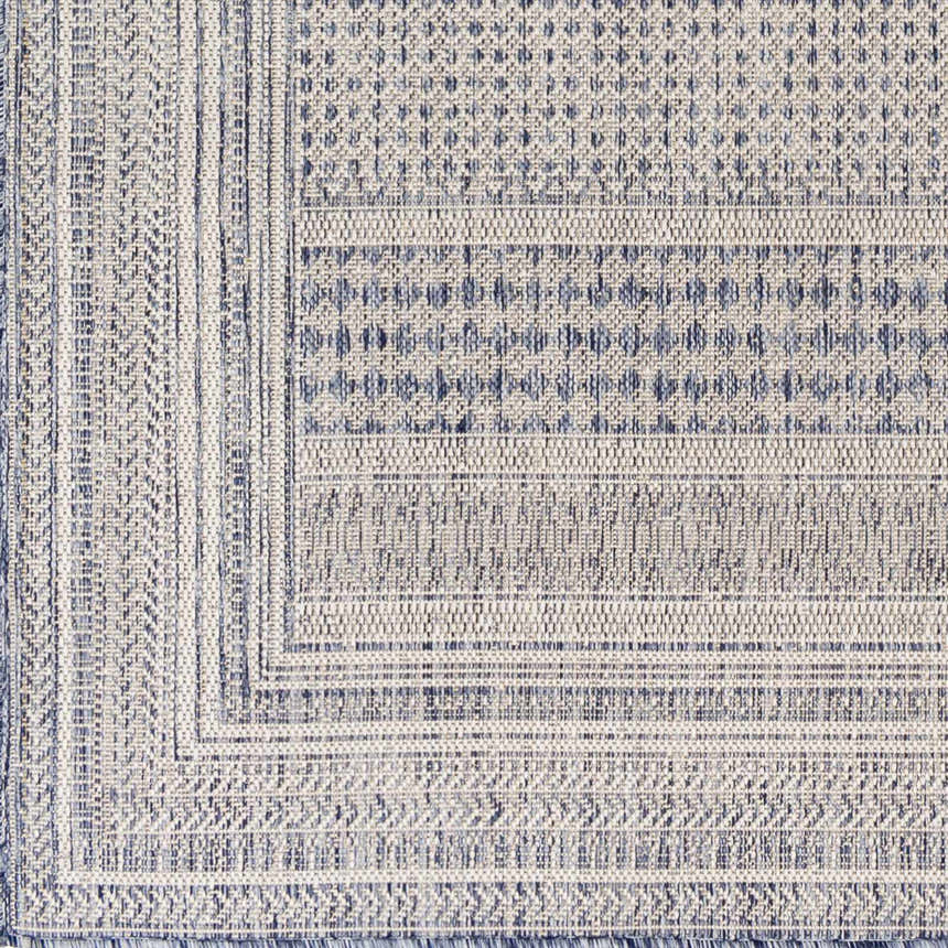 Close-up of the Panaytayon Area Rug showing its woven texture and geometric pattern in cream, natural gray, and navy. Swatch
