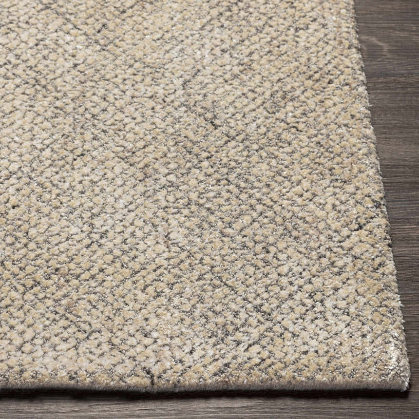Close-up of the Phalaborwa Area Rug. Hand-loomed with a textured, contemporary design in gray, light beige, and tan wool-viscose blend. Front