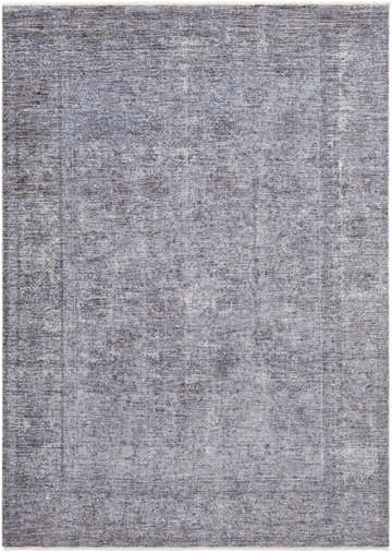 Close-up of the Plympton Carved Statement Rug, showing a textured pattern in shades of blue, gray, and ivory. Design-Rectangle