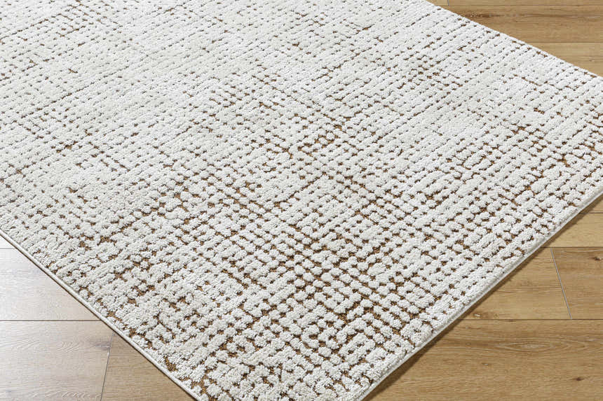 Close-up of the Cascade Minimalist Rug by Our PNW Home x Livabliss, featuring an ivory and brown geometric pattern. Corner