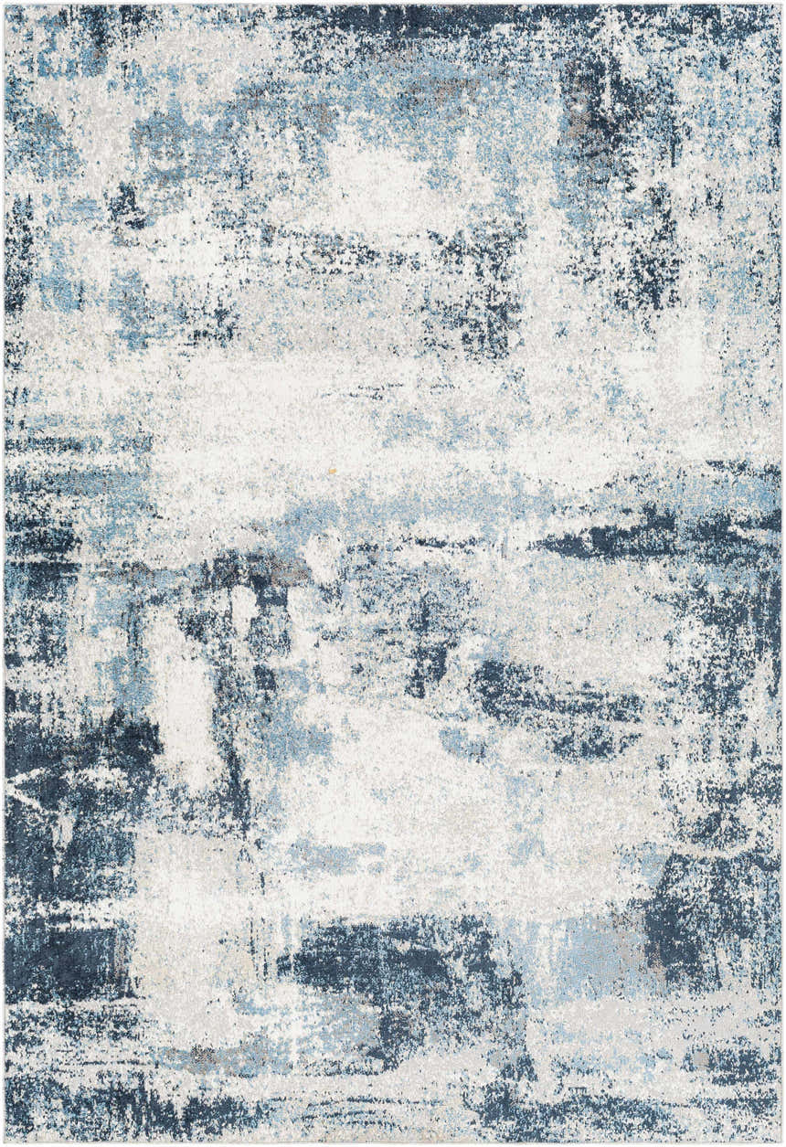 Close-up of the Pugo Washable Area Rug in blue, cream, and gray. Abstract pattern with a slightly distressed texture. Design-Rectangle-537