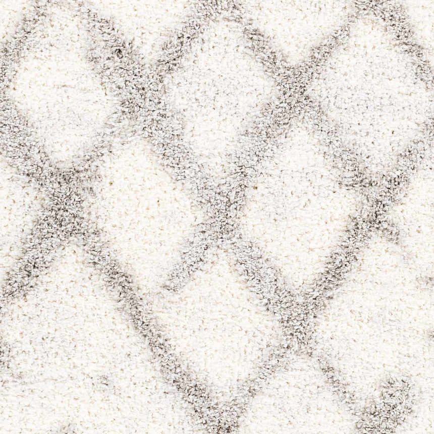 Close-up of the Putat Area Rug, a textured shag rug with a gray diamond pattern on a white background. Swatch