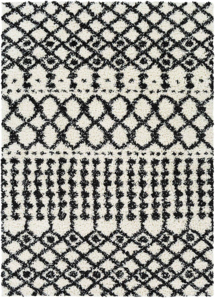 Close-up of the plush Walkern White/Black rug. Features a geometric diamond pattern in black on a cream shag texture. Bohemian style. Design-Rectangle-5373