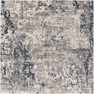 Close-up of the Ratho Rock Pattern Thick Rug. Features ivory, gray, tan, and dark blue abstract design. Design-Square-710