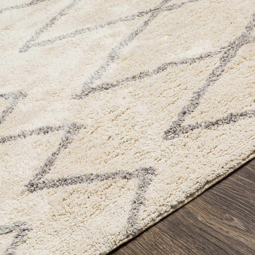 Close up of the hand woven Redlands Area Rug, cream and gray cotton with geometric pattern. Texture