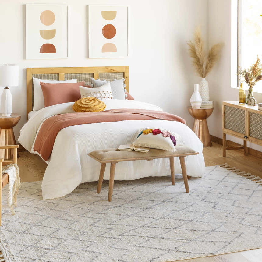 Light and airy bedroom with neutral decor and the cream and gray Redlands Area Rug. Roomscene-Rectangle