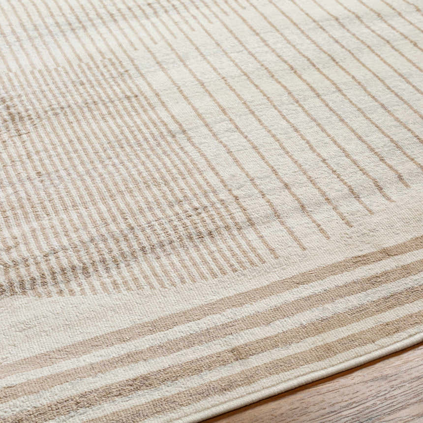 Close up of Zeke Geometric Nutmeg Rug showing its linear pattern and soft nutmeg and lambswool colors. Texture