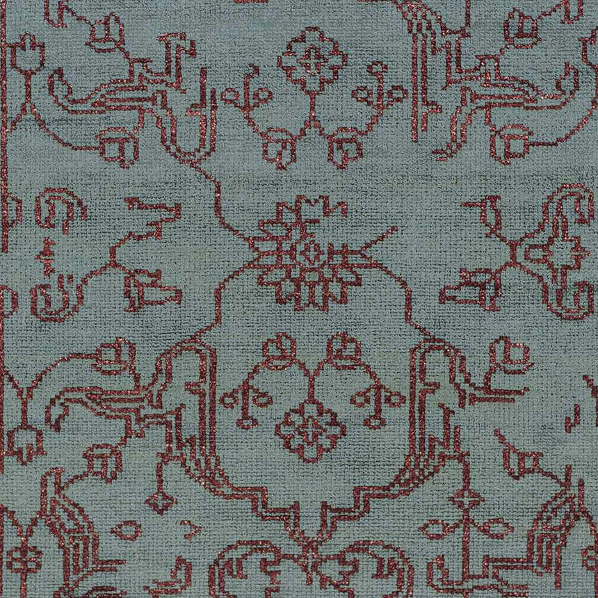 Close-up of the Redvale Area Rug showing its teal background and burgundy, hand-knotted, contemporary pattern. Swatch