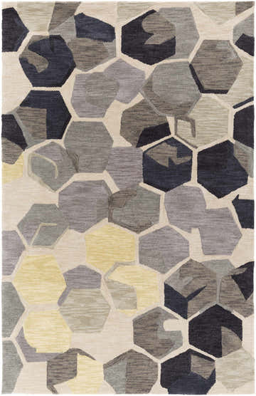 Close-up of the Romoland Area Rug - Clearance. Hand-tufted polyester rug with a contemporary geometric hexagon pattern in black, gray, and yellow. Design-Rectangle-576