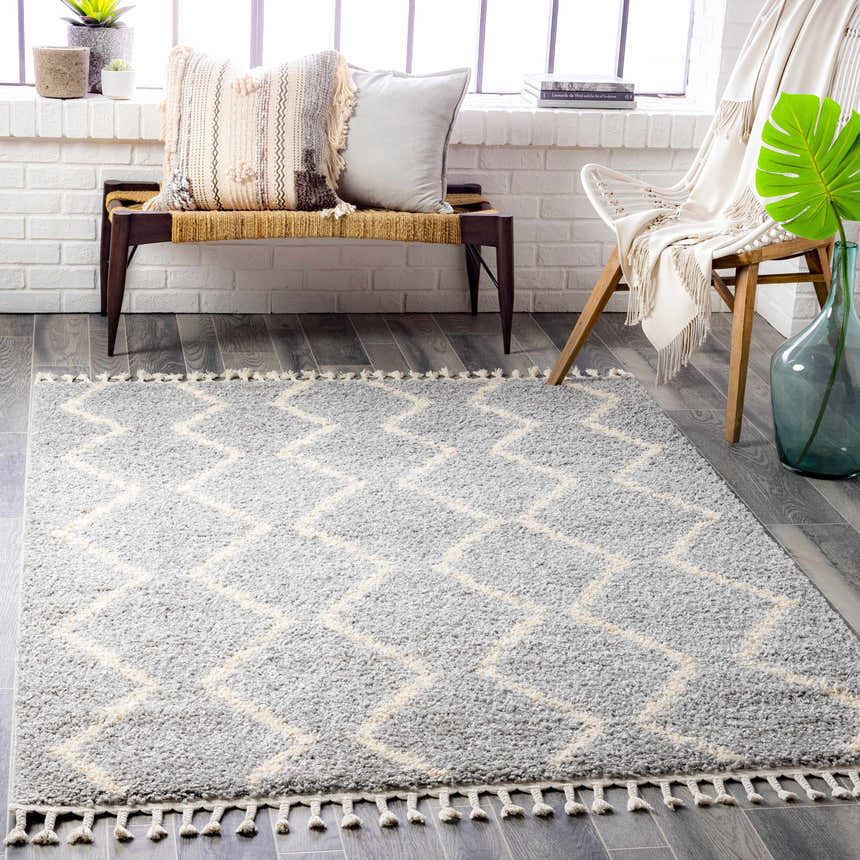 Bright room scene with a gray Royal Area Rug, bench, and white chair. Modern, cozy style. Roomscene-Rectangle