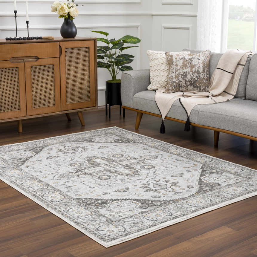 Living room scene with a light gray sofa and the Liverpool Light Gray Area Rug on a dark wood floor. Roomscene-Rectangle