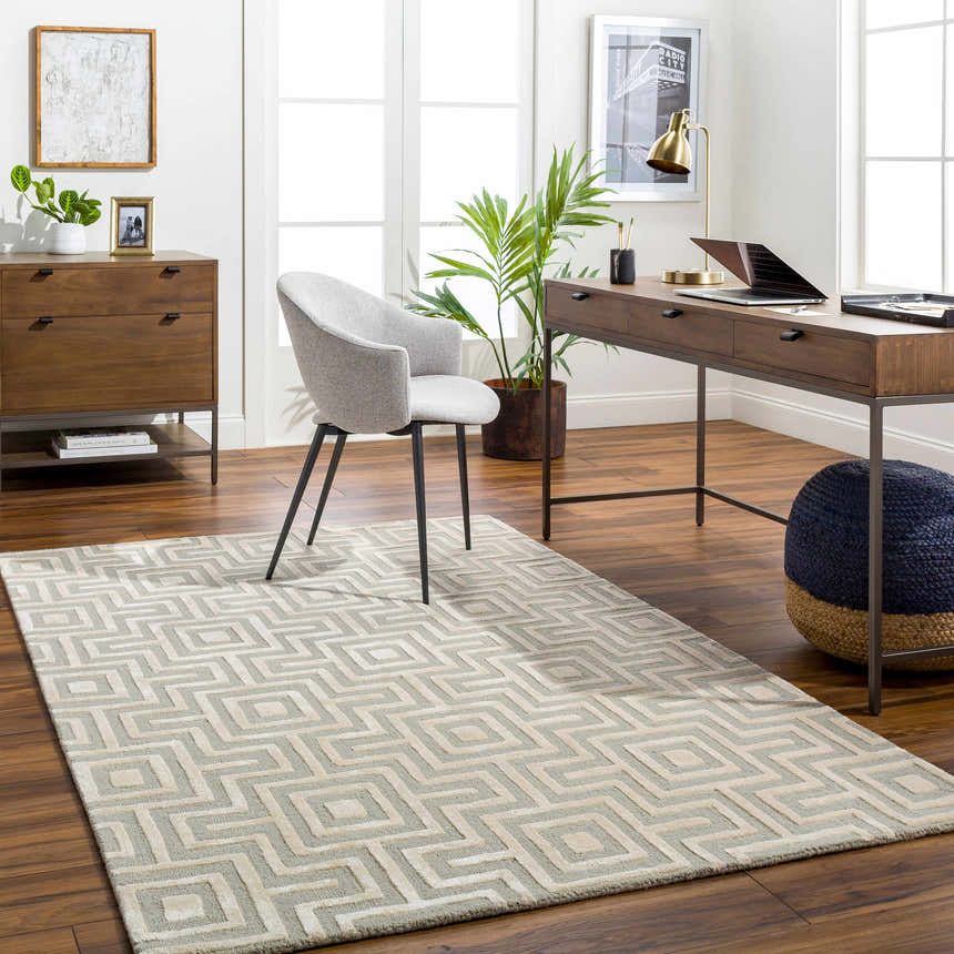 Home office with wood desk, gray chair, and Fynn Beige Area Rug featuring a geometric pattern. Roomscene-Rectangle