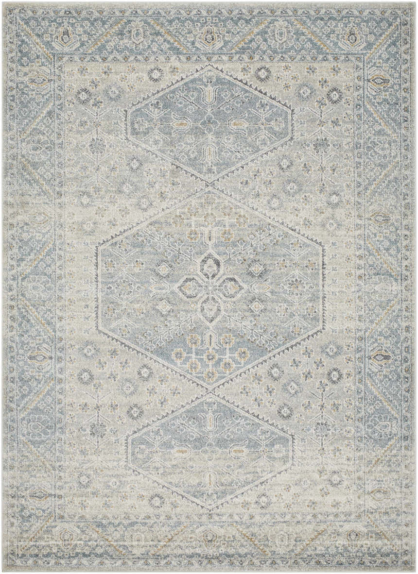 Detailed view of the Nydia Blue Medallion Area Rug, featuring a traditional diamond pattern in blue, gray, cream, and mustard tones. Design-Rectangle-679
