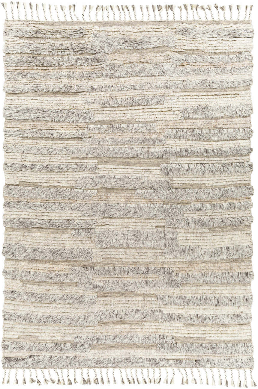 Close-up of the hand-knotted Saundersfoot Area Rug. Features charcoal, gray, and light beige wool with a textured, bohemian design. Design-Rectangle-69