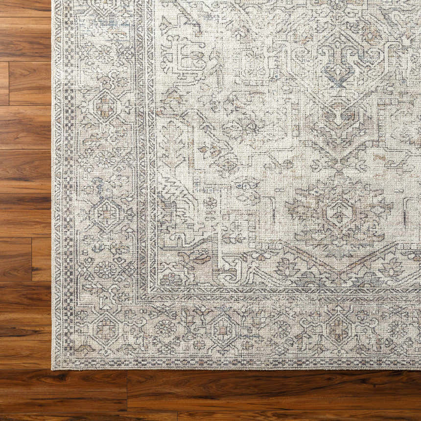 Close-up of the Margot Medallion Light Gray rug, a traditional design with brown, gray, and light blue tones on wood floor. Corner