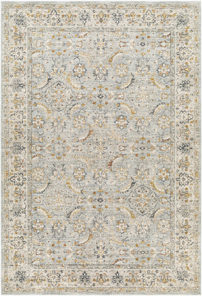 Close-up of the Jeven Blue Area Rug featuring a traditional floral pattern in beachhouse blue, beige, and gold tones. Design-Rectangle-6796