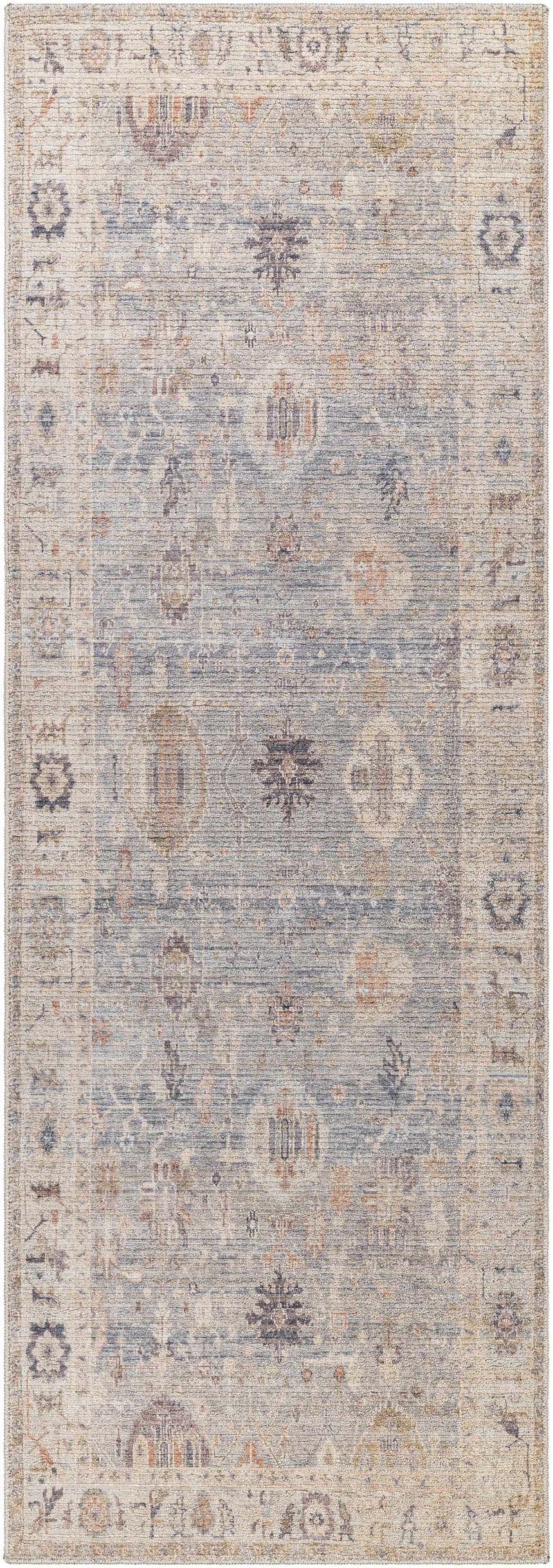 Close-up of the Marlene Damask Cream & Blue Area Rug, a traditional rug with a floral damask pattern. Design-Runner-2773