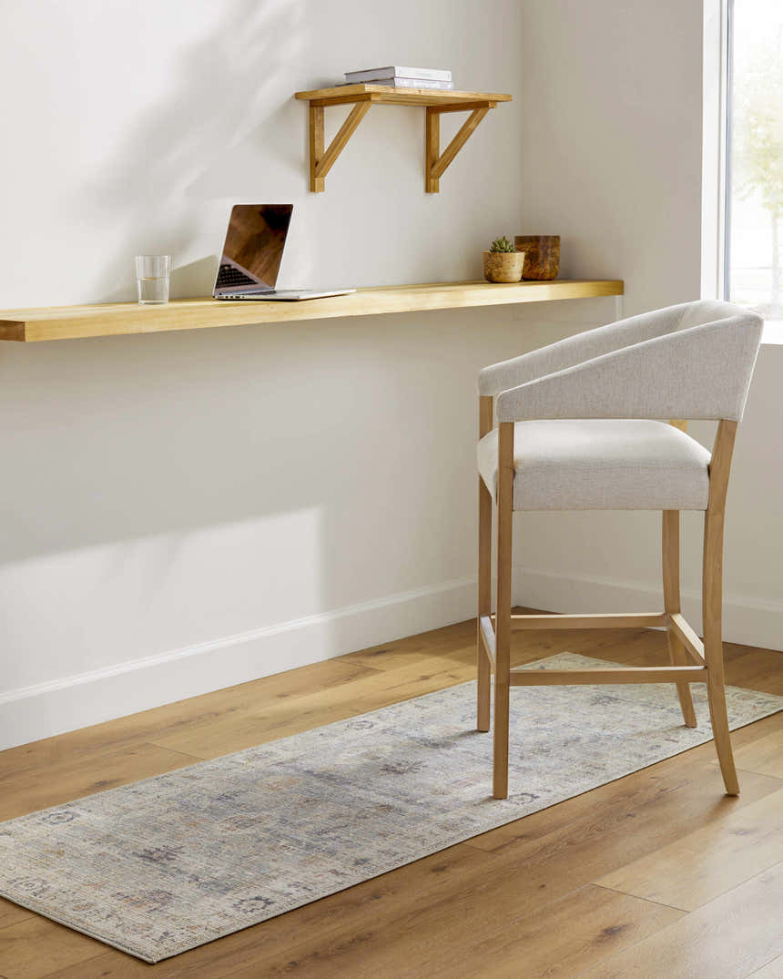 Home office with a Marlene Damask Cream & Blue rug runner under a modern chair, light wood desk, and hardwood floors. Roomscene-Runner