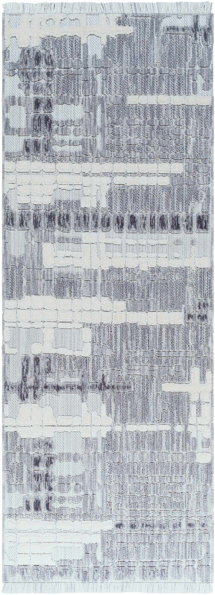 Close-up of the Bodhi Textured Saxony Rug with Fringes. Abstract pattern in charcoal, dark gray, light gray, and white. Design-Runner-2773