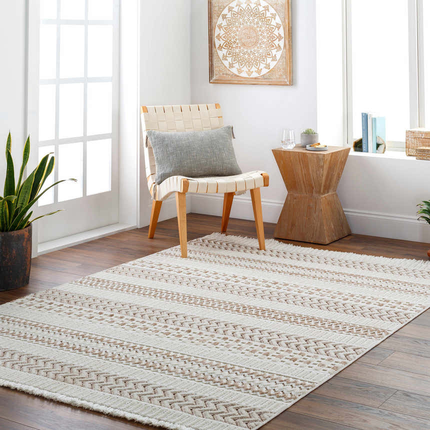 Living room scene with Eiko Beige Textured Saxony Rug, woven chair, wood side table, and neutral decor. Roomscene-Rectangle