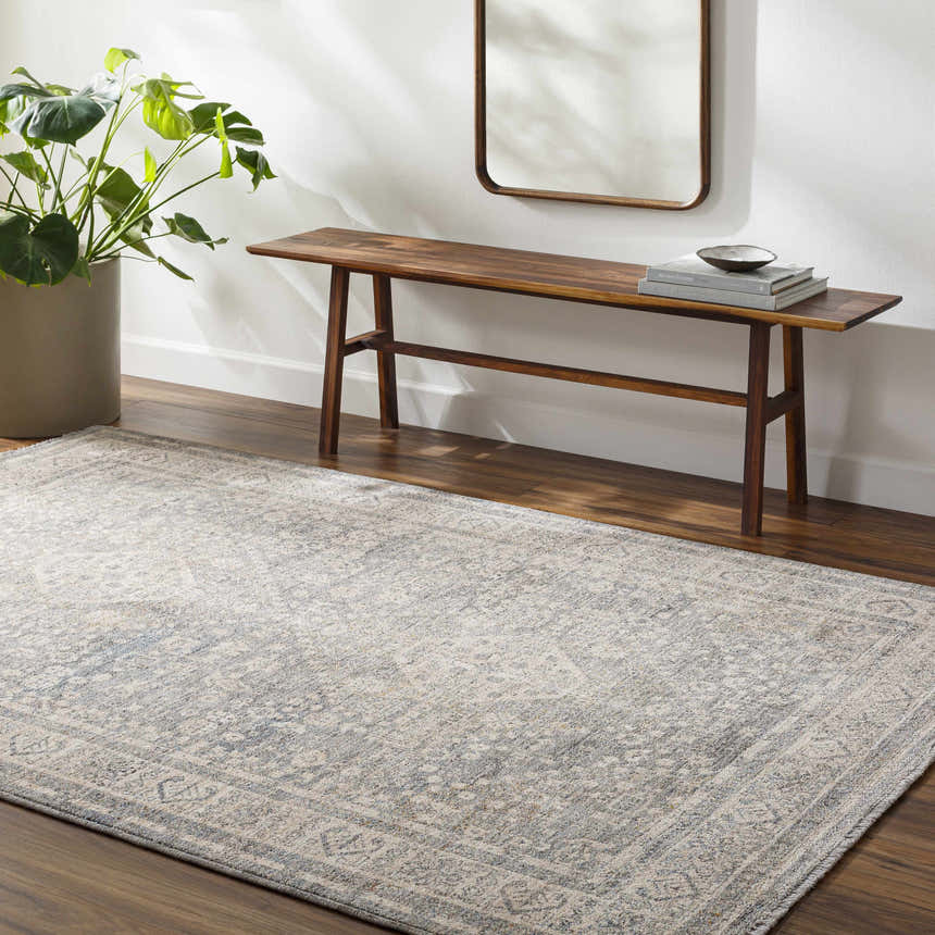 Entryway with Artan Area Rug in gray, brown wood bench, mirror, and potted plant. Farmhouse style. Roomscene-Rectangle