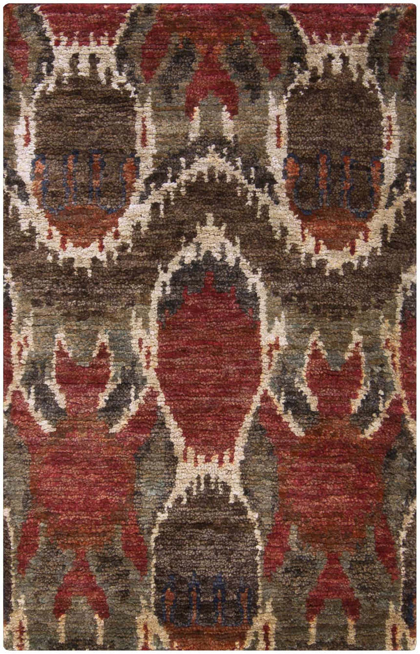 Close up of the Scotia Brown Ikat Jute Rug showing the brown, red, and beige bohemian pattern and jute texture. Design-Rectangle-3353