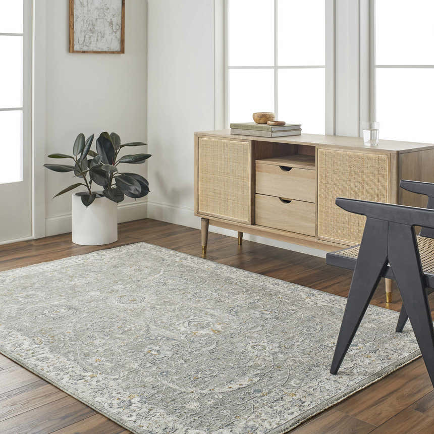 Living room scene with Gauge Gray Blue Textured Rug, wood floors, and a light wood cabinet. Roomscene-Rectangle