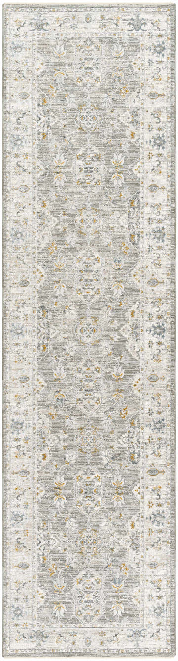 Close-up of the Hafsa Textured Rug. Gray rug with traditional floral pattern and subtle gold and blue accents. Design-Runner