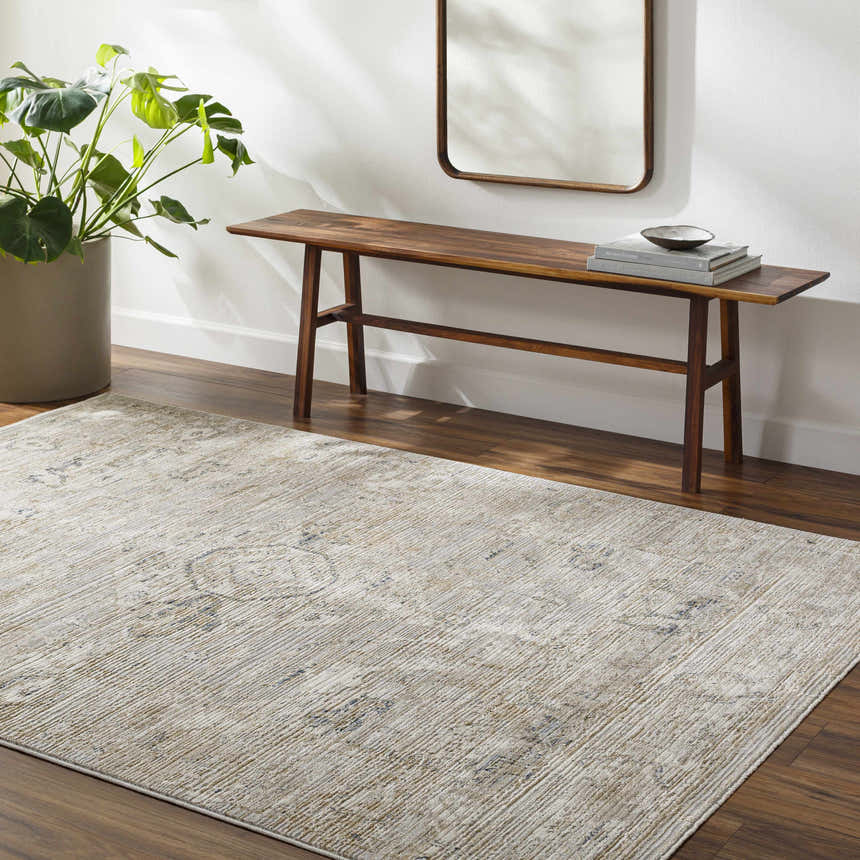 Entryway with wood floors and the beige Gioia Area Rug. Bench, mirror, and plant complete the farmhouse look. Roomscene-Rectangle