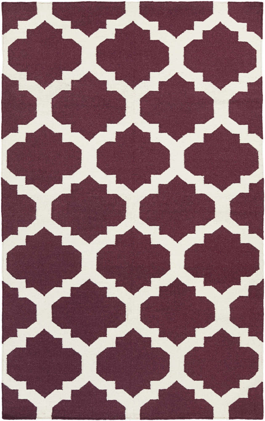 Close-up of the Shotton Area Carpet, a hand-woven wool rug with a dark purple and ivory geometric pattern. Design-Rectangle-58