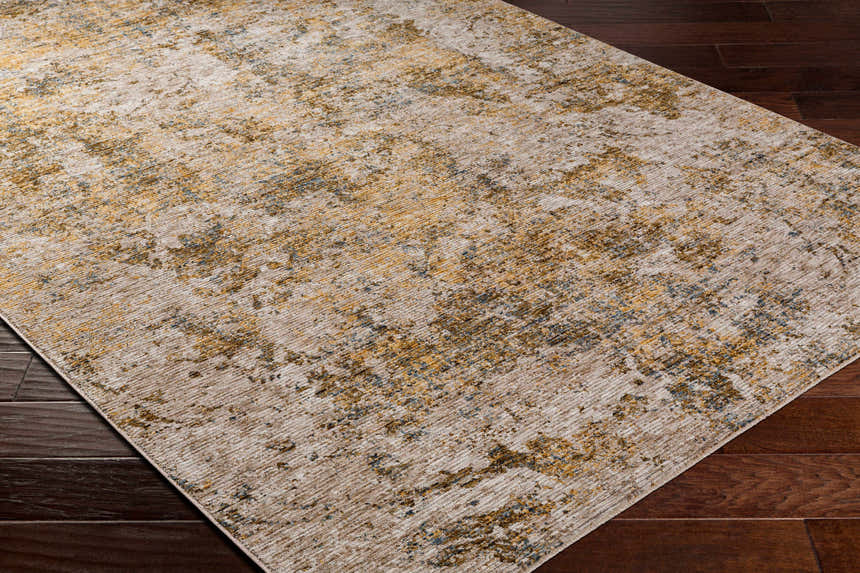 Close-up of the Aleka Rich Textured Rug in bone, clay, dark gray, and sage on a dark wood floor. Corner