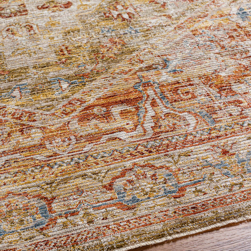 Close-up of the Alois Tan Rich Textured Traditional Rug, showing bone, clay, dark gray, and white thatch colors. Texture