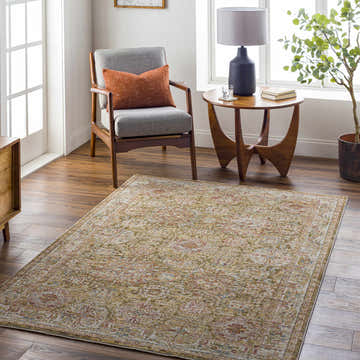Living room scene with Ange Tan Rich Textured Traditional Rug, gray chair, and wooden side table. Roomscene-Rectangle